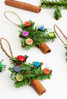 christmas decorations made out of cinnamon sticks and buttons