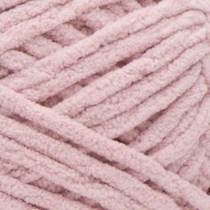 a close up view of a ball of pink yarn