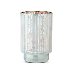 a clear glass vase sitting on top of a white table