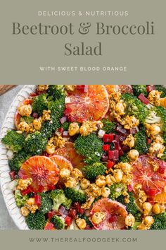 a white bowl filled with broccoli, blood oranges and walnuts on top