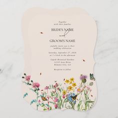 a wedding card with flowers and butterflies on it