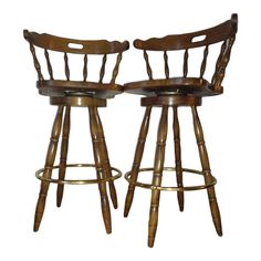 two wooden barstools sitting next to each other