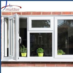 an open window with potted plants on the windowsill and brick wall behind it