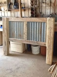 an image of a wooden bench made out of tin cans and wood pallets in a garage