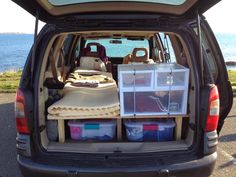 the back end of a van with several items in it