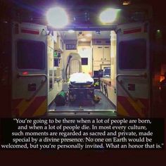 an ambulance with the door open and lights on it's sides are lit up