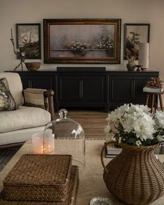 a living room filled with furniture and flowers