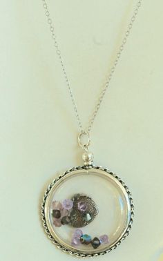 "This floating locket is made of 925 Sterling Silver. Simple to open locket: Unscrew the top, carefully remove the silver outer ring, and separate the two clear acrylic pieces. Please send me your fingerprint and I will make a fine silver heart insert to rest in the locket. I show a small heart in the photo. I also make a medium heart or large heart. Locket will also hold 2 photos back-to-back or treasured keepsakes such as dried flowers, small colored beads or a lock of hair. Dimensions: 35 mm Sterling Silver Locket Necklace For Keepsake, Sterling Silver Keepsake Locket Necklace, Sterling Silver Keepsake Locket Necklace With Round Pendant, Sterling Silver Medallion Locket Necklace With Charms, Round Locket Necklace With Charms For Keepsake, Sterling Silver Locket Jewelry For Keepsake, Sterling Silver Pendant Locket Necklace With Birthstone, Sterling Silver Birthstone Pendant Locket Necklace, Personalized Round Sterling Silver Locket Necklace