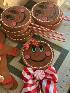 gingerbread cookies decorated with decorations and candy sticks