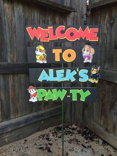 a welcome sign in front of a wooden fence with stickers on it that says, welcome to alex's pawty