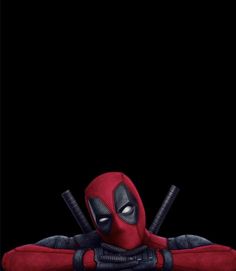 deadpool is laying on the ground with two baseball bats