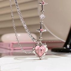 Chic Pink Crystal Heart Pendant Star Chain Necklace This adorable necklace features a shining pink crystal heart pendant and delicate star chain, adding a touch of loveliness to any outfit. Perfect for every day wear or special occasions. Heart Model, Girl Material, Desain Quilling, Y2k Accessories, Crystal Heart Pendant, Y2k Jewelry, Trendy Necklace, Vintage Choker, Trending Necklaces