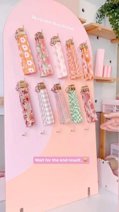 a pink display with lots of different items on it