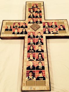 a cross with pictures of people on it