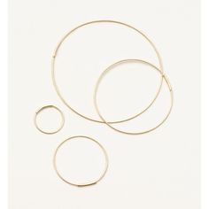 Beautiful, minimalist hoop earrings by Kathleen Whitaker. Thin stretched wire hoops with small tube closure. Delicate and timeless. Sold in pairs. 1" | 14 karat yellow gold Also available in extra small. Kathleen Whitaker, In Pairs, Hoop Earrings, Yellow Gold, Yellow, Gold