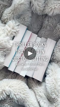 a pile of books sitting on top of a bed covered in fluffy white blankets and text that reads, trailer books that'd in just one sitting and why i found them so addictive