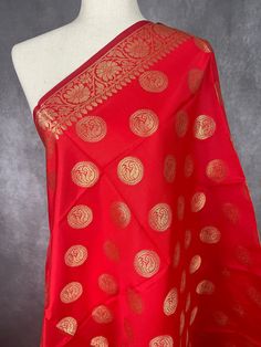 Gorgeous Bright Red Banarasi Dupatta. Dupatta is Soft and will add beauty to any Outfit. Makes a Perfect Gift! PLEASE NOTE - TASSLES AT THE ENDS OF THE DUPATTA ARE red IN COLOR. Item: DupattaColor : Bright RedFabric : Banarasi Silk (Non Pure Silk)Work : Zari Weaved with tassels Length of the dupatta : 35 inches (approx)Width of the dupatta : 92 inches (approx)Store Policies- No return or exchange will be accepted for color variations.- No return or exchange will be accepted if the color does not Red Banarasi Dupatta, Benarasi Dupatta, Floral Themed Wedding, Designer Dupatta, Cute Boutiques, Red Fabric, Bright Red, Pure Silk, Quality Clothing