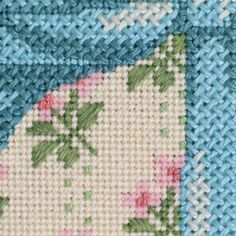 a close up view of a blue and white piece of cloth with flowers on it