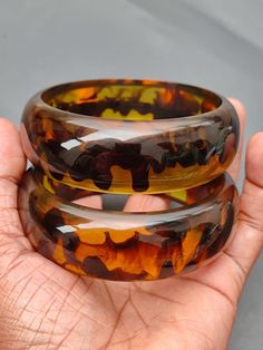 you will receive 1 Piece of Vintage Smooth Honey color Resin Bangle Bracelet Chunky Bangle Statement Purely Handcrafted Bohemian Unique Fashion Jewelry Gift Sale. Inner diameter size - 2.6" approx. Width Size: 23 mm. Thank you very much for visiting! Any questions, please feel free to contact us. Discount for bulk provide. Handmade Brown Round Bangle, Handmade Bohemian Brown Bangle, Handmade Brown Bohemian Bangle, Bohemian Handmade Brown Bangle, Adjustable Resin Bangle, Handmade Multicolor Resin Bracelets, 2024 Wishlist, Unique Fashion Jewelry, Color Resin