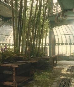 the inside of a building with lots of windows and plants in pots on the ground