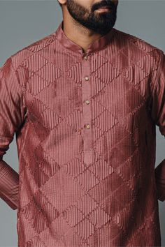 Editor's Note The maroon pintuck kurta and pant set in cotton silk offers a blend of sophistication and comfort. The kurta and pyjama combination is perfect for formal occasions or festive celebrations, exuding an elegant and refined look. Embrace the timeless appeal of this maroon pintuck kurta set for a stylish and graceful appearance. Fabric: Cotton silk Color: Maroon Components: Kurta and pants Occasion: Festive Note: Product colour may slightly vary due to photographic lighting sources Care Elegant Long Sleeve Sets With Pintucks, Festive Cotton Silk Kurta With Naqshi, Festive Cotton Silk Kurta With Naqshi Detail, Eid Straight Kurta With Pintucks, Eid Pintucks Straight Kurta, Traditional Sets With Pintucks For Eid, Traditional Eid Sets With Pintucks, Traditional Festive Kurta With Pintucks, Festive Traditional Kurta With Pintucks