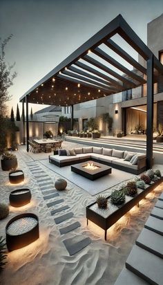 an outdoor living area with large couches and fire pit in the middle of it