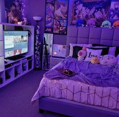 a bed room with a neatly made bed and a flat screen tv