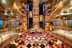 the inside of a large cruise ship with lots of seating