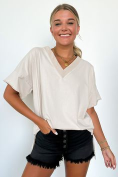 Details: Elevate your everyday look with our Pretty Potential V-Neck Oversized Top. This vintage-inspired tee features a light mineral wash and an oversized fit for a relaxed look. The V-neck front and side slit detail add a touch of style. Made from soft cotton, pair it with shorts or biker shorts for a cool outfit this season. - Short sleeves - V-neck - Relaxed fit - Light Mineral Wash Content: 100% Cotton Size + Fit: Model is 5'8" and 5'4" (Aqua) and wearing a Small - Approximate measurements Cool Outfit, Crop Top Sweater, Oversized Top, Back In Stock, Skirt Leggings, Women Clothing Boutique, Clothing Boutique, Biker Shorts, Cute Tops