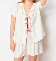 🌙 Slip into comfort with our White Pajama Set featuring an adorable Pink Bow 🎀. Perfect for a cozy night's sleep 🛌 or lounging around the house 🏠. Soft, breathable fabric ensures you stay comfortable all night long 🌟. Add a touch of elegance and fun to your nighttime routine with this charming set! 💕 Hello, Thank you for choosing to shop with us on Etsy! We appreciate your support and are thrilled to be able to provide you with unique and beautiful watches. We understand that keeping you informed about the shipping process is essential, so we want to assure you that we are committed to ensuring a smooth and timely delivery. Once your order is placed, our team works diligently to process it as quickly as possible. We carefully package each item to ensure its safety during transit. Onc White Feminine Sleepwear For Relaxation, White Short Top For Sleepover, Feminine White Pajama Shorts For Loungewear, White Short Sets For Daywear, Pink Short Set For Sleep, White Short Set For Pajama Party, Spring Sleepover Short Set, Feminine White Sets For Sleepover, Spring Pajama Party Short Set