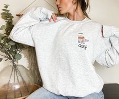 Are you ready for FALL?! And are you looking for a unique, cute sweatshirt design to wear as the temperatures drop? This 'Cozy Wool Socks' sweatshirt is the perfect, unique crewneck pick for fall! Available in white, ash grey, sport grey, heather grey, black, or sand (so you can buy one for your best friend/husband/boyfriend/girlfriend, etc too!). Models in the photos are wearing a large. Sweatshirt details are below: Ideal for any situation, a unisex heavy blend crewneck sweatshirt is pure comf Dog Mom Sweater, Navy Girl, Bunny Mom, Mom Sweater, Christmas Sweaters For Women, Funny Christmas Sweaters, Nurse Sweatshirt, Feminist Shirt, Sweatshirt Crewneck