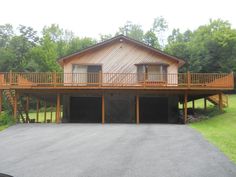 a large house with two car garages in front of it