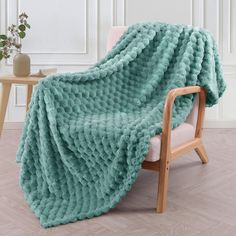 a chair with a blanket on top of it