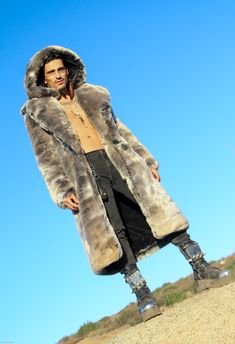 MENS’S VANDAL COAT FEATURES High quality Tissavel Chinchilla faux fur. ** Limited Edition Fur. Lined with super soft cuddle minky fabric. 2 Deep zipper pockets on the inside front sides (large enough for a water bottle). 6" Invisible ID pocket on the inside left chest lining. Two outside pockets to keep your hands warm. Inside back pack straps to wear the coat like a backpack when you are hot. Zip-off fur hood. Front button closure and button at hood to close the front of the coat over to cover Mink Faux Fur Coat With Faux Fur Lining, Mink Colored Faux Fur Coat, Mink Faux Fur Coat, Festival Coats, Chinchilla Fur, Vest Coat, High Five, Music Festivals, Fur Hood