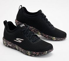 Breeze through your daily walks or be prepared for more adventurous outings with these bungee sneakers. Well-cushioned ULTRA GO and Goga mat technologies contribute to their cloud-like comfort, while the floral printed midsole adds a bit of fun flair. And don't worry if they get a little dirty -- just toss 'em in the wash. From Skechers. Black Casual Walking Shoes With Gel Cushioning, Casual Black Walking Shoes With Gel Cushioning, Functional Walking Shoes For Sports In Spring, Functional Walking Shoes For Spring Sports, Spring Functional Walking Shoes For Sports, Black Walking Shoes For Spring Sports, Spring Outdoor Running Shoes With Cushioned Footbed, Breathable Slip-on Sneakers With Cushioned Footbed For Running, Black Breathable Fabric Slip-on Sneakers For Running