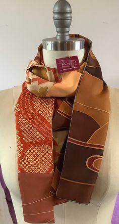 This unique double sided scarf is handmade using vintage Japanese silk kimono and silk offcuts.   The colours and patterns are just stunning. The autumn colours are rich and warm. Every one of my scarves is unique and I take time to select each piece of silk to complement each other.  You will receive lots of admiring comments when you wear this beautiful scarf! Traditional Brown Silk Scarves, Brown Silk Scarves For Fall, Vintage Silk Rectangular Scarf, Bohemian Brown Silk Scarves, Brown Bohemian Silk Scarves, Bohemian Brown Silk Scarf, Bohemian Rectangular Silk Scarf, Traditional Brown Silk Scarf, Fall Multicolor Silk Scarf