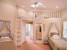 two beds in a room with pink carpeting and white railings on the ceiling