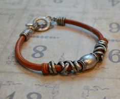 This distressed leather wrap bracelet is a perfect gift for Dads.However the design is UNISEX and can be worn by both men and women. Material: Top grain leather Color: light brown tanClosure: toggle claspLength: 7.5" totalWidth: 10-15mm Vintage Brown Wrap Bracelet Gift, Vintage Brown Wrap Bracelet, Vintage Brown Everyday Bracelets, Everyday Vintage Brown Bracelets, Vintage Brown Adjustable Wrap Bracelet, Vintage Brown Leather Everyday Bracelet, Everyday Vintage Brown Leather Bracelet, Rustic Brown Leather Bracelet For Everyday, Nickel-free Brown Leather Bracelet As Gift