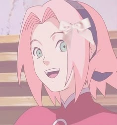 an anime character with pink hair and blue eyes smiles at the camera while sitting on a bench