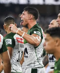 the rugby players are celebrating their victory over the team in the match between australia and new zealand