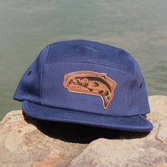 We made a design for all you fly fisherman out there- or just for those of you drawn to the water. The first design in our "Choose Your Adventure" t-shirt and hat collection, we call this the River Runner. 🐟 🐟 🐟 Grab it on a navy 5-panel hat or a black moisture wicking nylon rope hat perfect for life on the water. Casual Snapback Hat With Flat Bill For Fishing, Casual Flat Bill Baseball Cap For Fishing, Casual Flat Bill Snapback Hat For Fishing, Casual Short Brim Baseball Cap For Fishing, Blue Adjustable Trucker Hat For Camping, Adjustable Blue Trucker Hat For Camping, Casual Short Brim Trucker Hat For Fishing, Blue Summer Hiking Hat, Casual Snapback Hat For Fishing