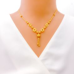 This 22k gold necklace, with a weight of 9.1 grams, showcases a charming cutwork flower design, beautifully rendered in a gleaming yellow gold finish. The necklace spans 17 inches in length, featuring a drop of 1.25 inches, and comes with 1 inch of adjustable links for a tailored fit, secured by an S lock. The intricate cutwork adds a touch of delicacy and elegance, making this piece perfect for those who appreciate the beauty of floral motifs combined with the luxurious appeal of gold. Ideal for adding a sophisticated and feminine touch to any outfit, this necklace is a testament to exquisite craftsmanship and timeless style. PRODUCT DETAILS Gold Purity(karat): 22k Gold Weight(grams): 9.1 Item Finish: Yellow Gold Necklace Length: 17" Drop Length: 1.25" Adjustable Links: 1" Links Lock Styl Traditional Yellow Gold Flower Pendant Necklace, 22k Gold Filigree Yellow Necklaces, 22k Yellow Gold Flower Pendant Necklace, Gold Flower Pendant Necklace In 22k, Gold Necklace With 22k Gold Flower Pendant, 22k Gold Flower Pendant Necklace, 22k Gold Necklace, Yellow Gold Necklace, Floral Motifs