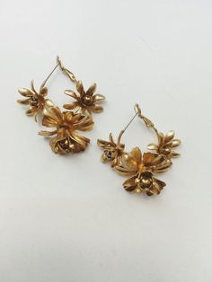 1 medium and 2 small brass blossoms on a hoop.-made in France- approximately 1.5in(3.5cm) long x 1in (3cm) wide-hematite or moonstone centers Jennifer Wood, Personal Checks, Favorite Color, Moonstone, Hoop Earrings, Ships, Brass, Drop Earrings, France