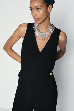 ASYMMETRIC VEST JUMPSUIT - Black | ZARA United States Sleek Sleeveless Jumpsuits And Rompers For Work, Sleek Sleeveless Jumpsuit For Work, Elegant Asymmetrical Jumpsuits And Rompers For Work, Sleeveless Formal Jumpsuits And Rompers By Zara, Sleeveless Evening Jumpsuits And Rompers By Zara, Zara Sleeveless Evening Jumpsuits And Rompers, Zara Sleeveless Jumpsuits For Evening, Zara Sleeveless Jumpsuits And Rompers For Party, Waistcoat Jumpsuit