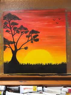 an acrylic painting of a tree in the sunset