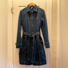 Vintage Women’s Brand New Denim Wash Trench Coat. Cool Design At Cuff And Has Two Sets Of Pockets On The Front. It Is Heavy Denim Material. Brand New But No Tags. Utility Long Sleeve Outerwear In Medium Wash, Medium Wash Long Sleeve Utility Outerwear, Fall Medium Wash Utility Jacket, Denim Collared Utility Jacket For Fall, Fall Denim Utility Jacket With Buttons, Medium Wash Long Sleeve Utility Jacket For Work, Fitted Utility Denim Jacket With Pockets, Denim Utility Jacket With Buttons For Fall, Medium Wash Utility Jacket For Winter Workwear