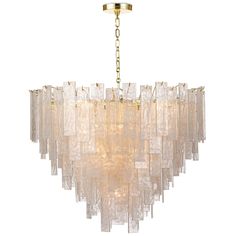 a chandelier made out of glass blocks and gold chains on a white background