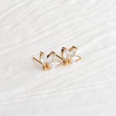 Cz Stud Earrings, Gold Vermeil Studs, Tiny Earrings, Dainty Studs, Unique Stud, Gift For Girlfriend, Bridesmaid Earrings Stud, Cubic Zirconia Earrings, Gift for her Specifications - ✔️ Made to Order. ✔️ Gemstone Name ~ High Grade Cubic Zirconia ✔️ Gemstone Size ~ 6 x 3mm ✔️ Metal Options ~ 14k Gold Vermeil  ✔️ Handmade Jewelry Everything in my shop is handmade. Each item will be beautifully packed in a recycled box. I happily take all customized orders. Q: What is 14k gold filled Jewelry ? A: Gold filled jewelry is 5% real gold. The 14k gold filled jewelry is easy to care for and will usually maintain its golden shine for a lifetime. Dainty Cubic Zirconia Bridal Earrings Gift, Dainty Hypoallergenic Diamond Wedding Earrings, Dainty Cubic Zirconia Flower Earrings For Wedding, Dainty Hypoallergenic Flower Earrings For Wedding, Unique Studs, Stud Earrings Gold, Mini Studs, Dainty Studs, Tiny Earrings