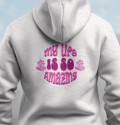 My Life Is So Amazing Hoodie | Trendy Hoodie | Tumblr Hoodie | Positive Hoodie | Aesthetic Summer Hoodie, Travel Gear, Unisex Vacation Hoodie, Positive Vibes, Summer Wear GENERAL INFORMATION > Unisex heavy blend hooded sweatshirt  > Soft and Warm > Front Kangaroo Pocket  > Classic Fit  > Tear-Away Label for comfort > Double-Lined Hood MATERIAL > Thick Blend of 50% Cotton and 50% Polyester  > Heather Sport Colors - 60% Polyester, 40% Cotton CARE INSTRUCTIONS > Machine wash: warm (max 40C or 105F); Bleach as needed; Tumble dry: medium; Iron, steam or dry:     low heat; Do not dryclean. I M P O R T A N T > Order cancellations are accepted for 2 hours after purchase. > Please note that, due to variations amongst computer monitors, actual colors may vary slightly from     what appears on your s Vsoc Style Hoodie Sweatshirt With Letter Print, Vsco Style Sweatshirt Hoodie With Letter Print, Vsco Style Letter Print Hoodie Sweatshirt, Vsco Style Hoodie Sweatshirt With Letter Print, Winter Vsco Hoodie With Letter Print, Retro Letter Print Hoodie Sweatshirt, Retro Hoodie Sweatshirt With Letter Print, Cotton Vsco Hoodie With Graphic Print, Cotton Graphic Print Vsco Hoodie