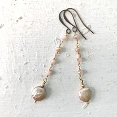 Dangle Earrings of Pale Pink Crystal Gold Bead Chain with a single gorgeous Pink Freshwater Coin Pearl! The coin pearls are bookended with tiny fluted gold plated metal beads and wire wrapped to the bead chain above. Hung on Gold Tone French Ear Wires, they make for the perfect pair of Neutral Elegance to add to your jewelry box. Measure 2 3/4 inches long and are full of swing and movement, yet oh so very lightweight and comfortable to wear. Enjoy these and other options coming soon too! Stand out from the crowd Penelope & Anastasia babes and follow the journey on IG & FB  @PenelopeAndAnastasia for first dibs on new items, SALE announcements, and in-person shopping opportunities! Xoxo ~ Pamela Elegant Beaded Chain Drop Earrings, Elegant Adjustable Beaded Earrings With Beaded Chain, Elegant Adjustable Beaded Earrings, Elegant Beaded Chain Dangle Earrings, Elegant Beaded Chain Earrings As Gift, Elegant Beaded Chain Earrings For Gift, Pearl Beaded Dangle Jewelry, Pearl Beaded Chain Dangle Jewelry, Beaded Pearl Dangle Jewelry